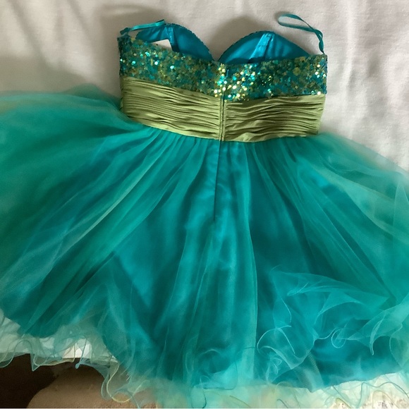 Blue sequined dress with green silk fabric across waist, puffy with silk under. - Picture 2 of 3